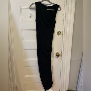 Black Bebe maxi dress with ruching on the side.